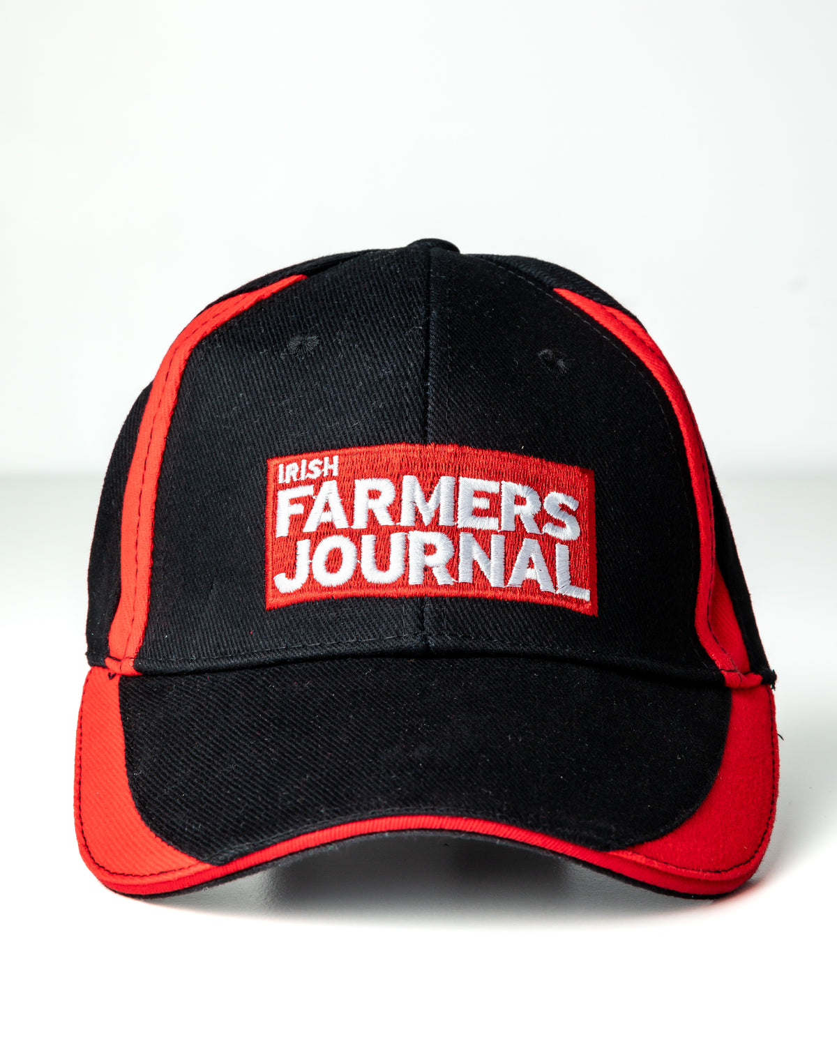Black and red Irish Farmers Journal baseball cap with the embroidered crest on the front panel